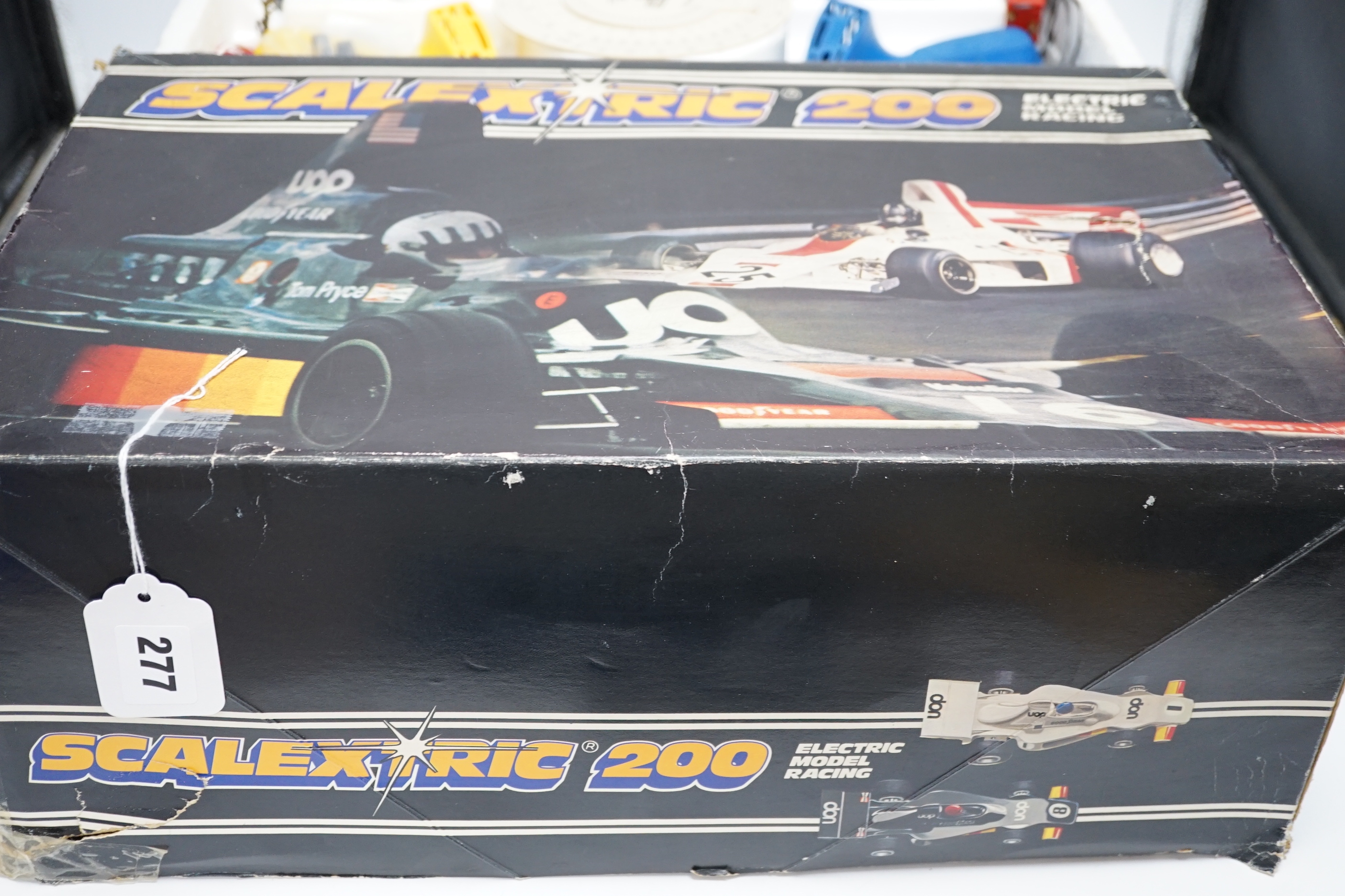 A Scalextric 200 set, comprising of two cars, controllers, track sections, etc.